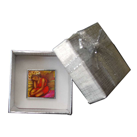 Decorative box with a small painting printed on a brooch pin.