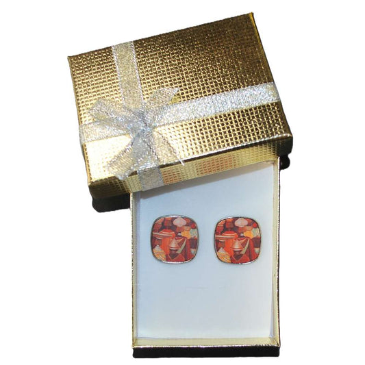 Gift box with a bow containing square stud earrings with ethnic artwork by Idalet