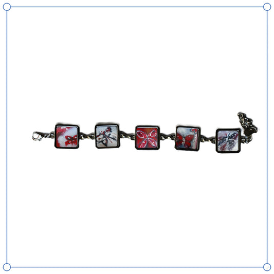 Bracelet with square charms featuring butterfly designs on a white background